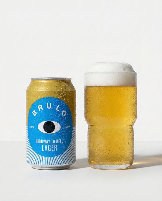 Brulo Highway to Helles poured into a glass beside the can, clear golden with white foam