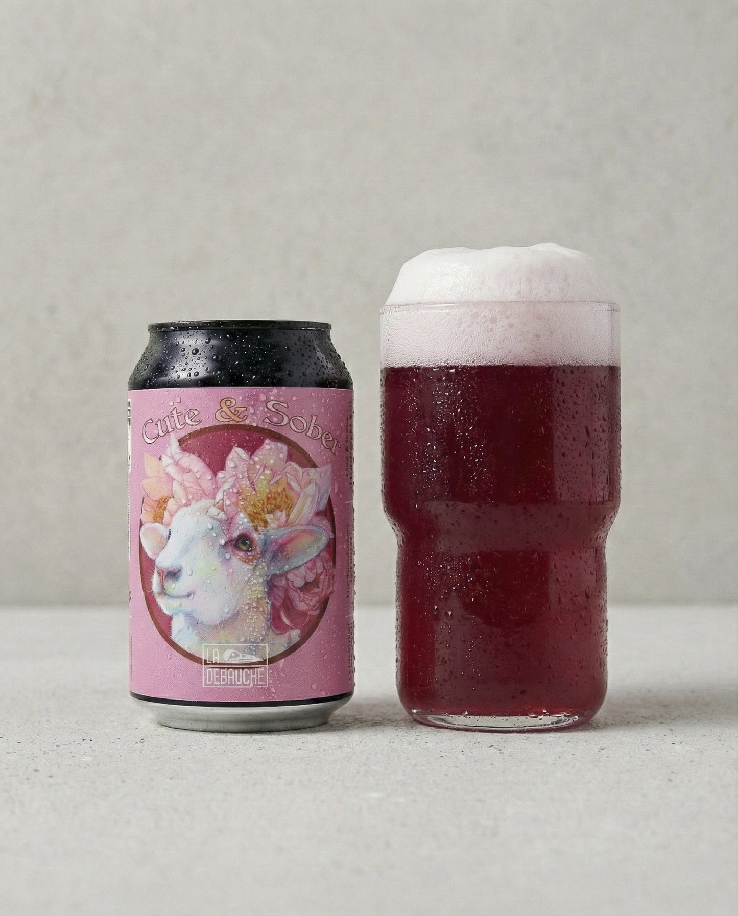 La Débauche Cute & Sober poured into a glass with foam head