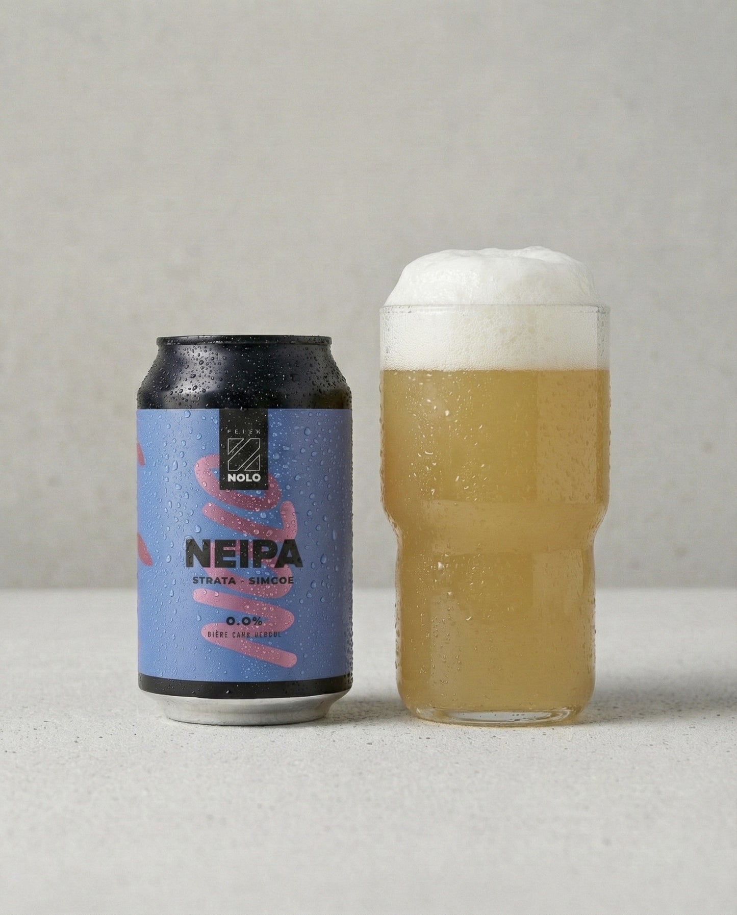 Prizm NOLO NEIPA poured into a tulip glass with foam head