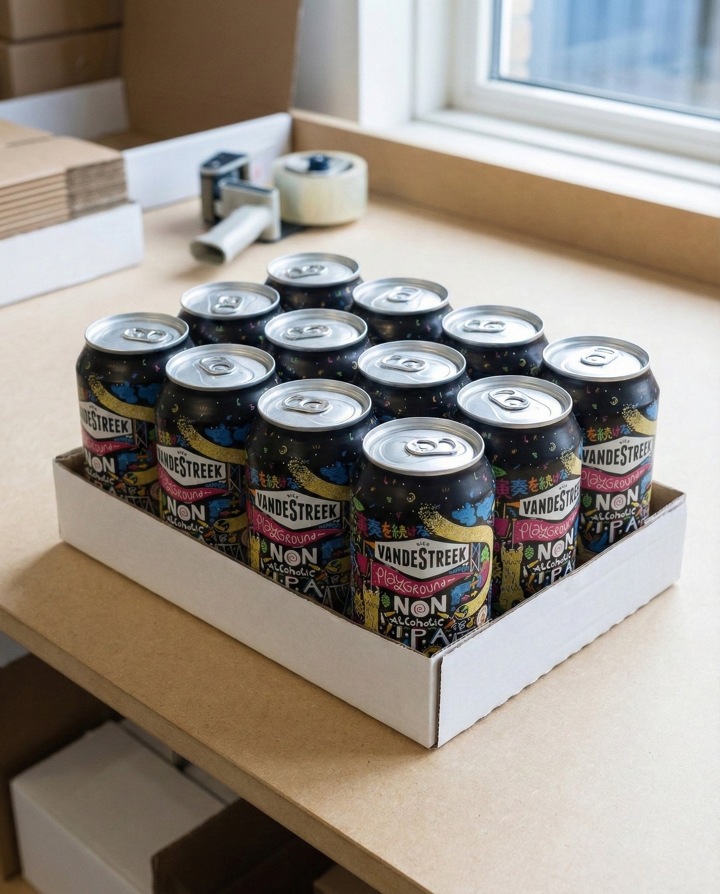 Twelve Vandestreek Playground cans arranged on concrete background