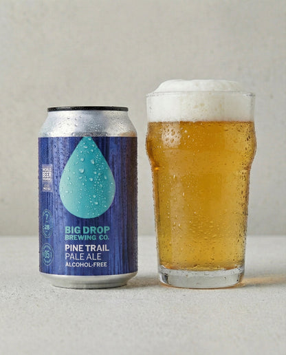 Big Drop Pine Trail Pale Ale poured into a glass with foam head