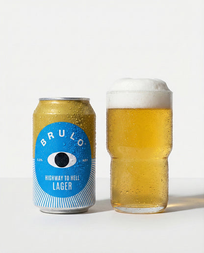 Brulo Highway to Helles poured into a glass beside the can, clear golden with white foam