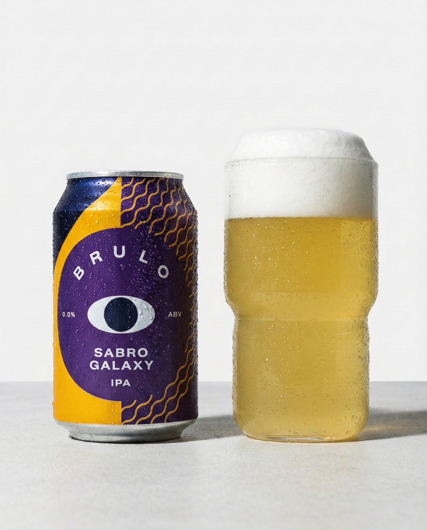 Brulo Sabro Galaxy poured into a glass with foam head