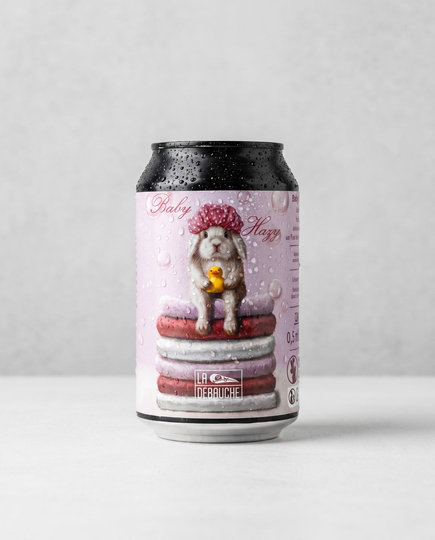 La Débauche Baby Hazy 0.5% alcohol-free can front view on concrete background
