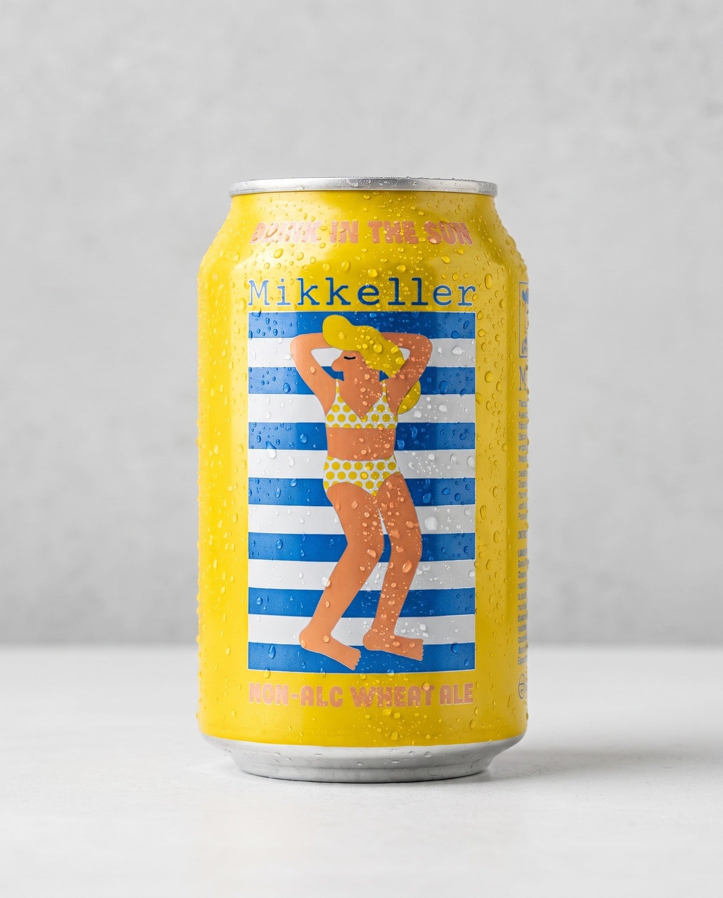 Mikkeller Drink'in the Sun 0.3% non-alcoholic wheat ale can front view on concrete background