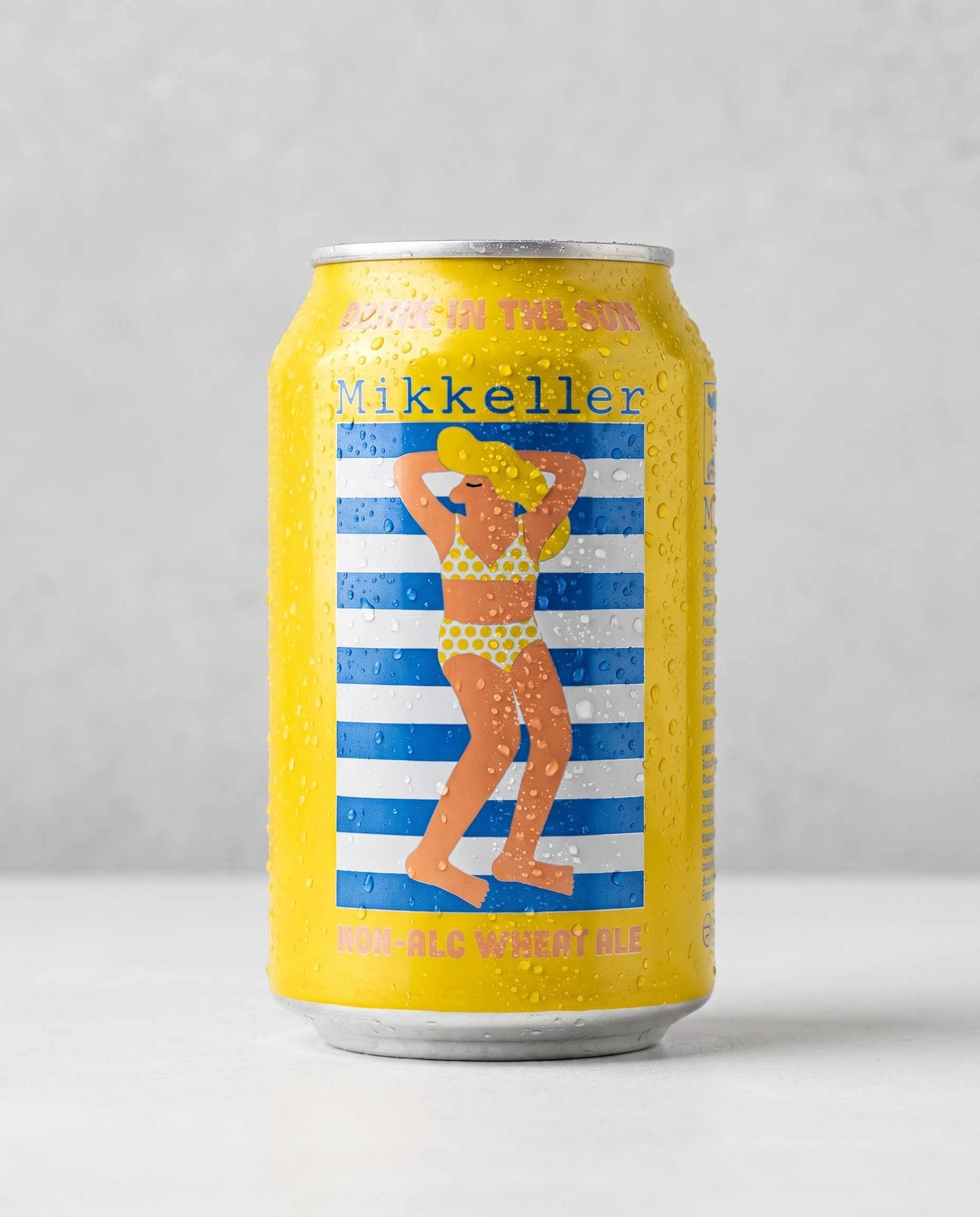 Mikkeller Drink'in the Sun 0.3% non-alcoholic wheat ale can front view on concrete background