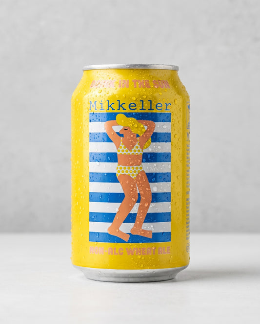 Mikkeller Drink'in the Sun 0.3% non-alcoholic wheat ale can front view on concrete background