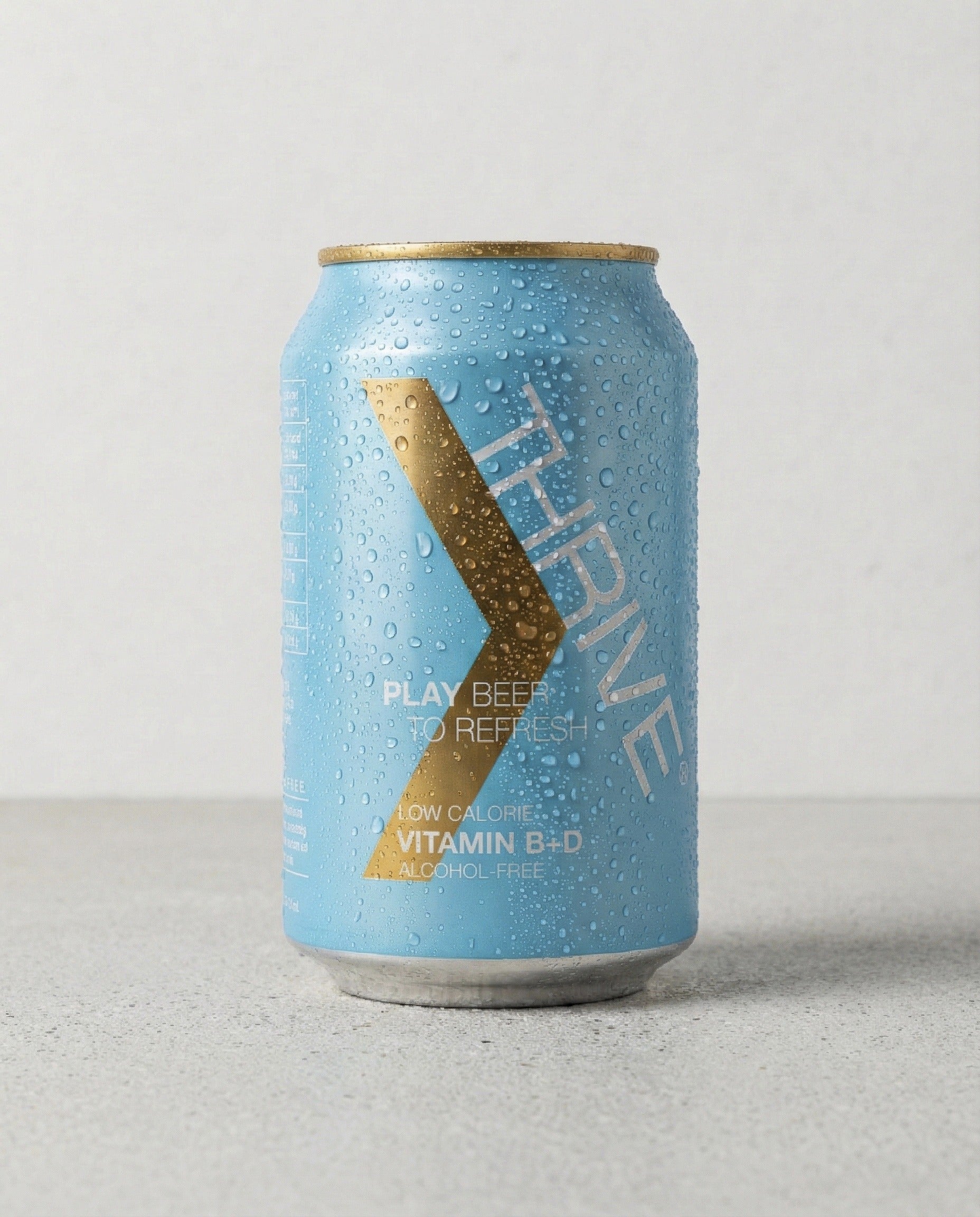 Thrive Play Beer can front view on concrete background