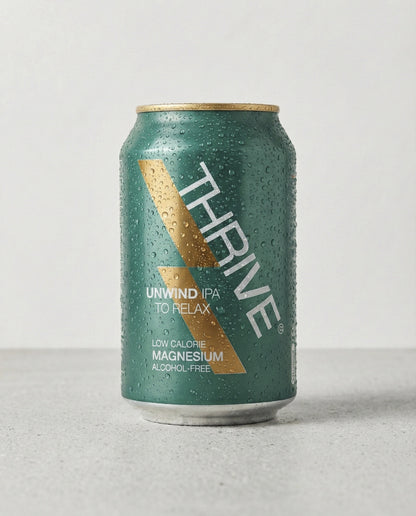 Thrive Unwind Beer can front view on concrete background