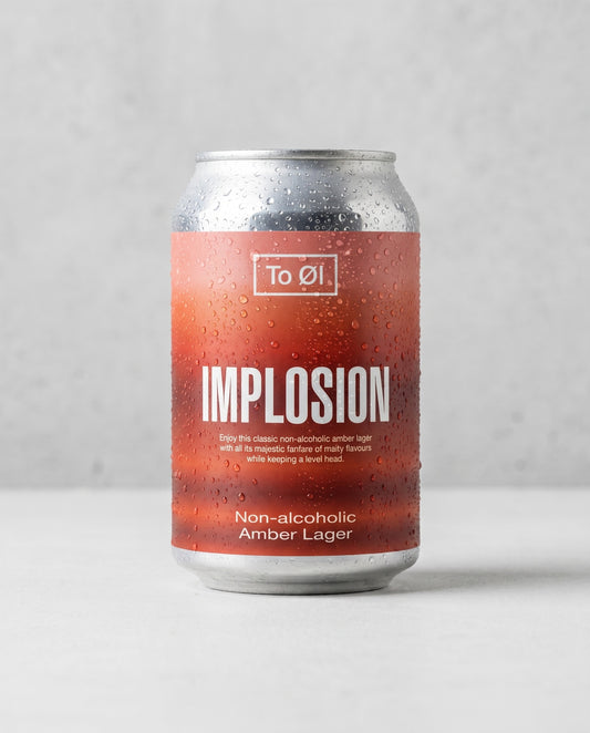 To Øl Implosion Amber Lager 0.5% alcohol-free can front view on concrete background