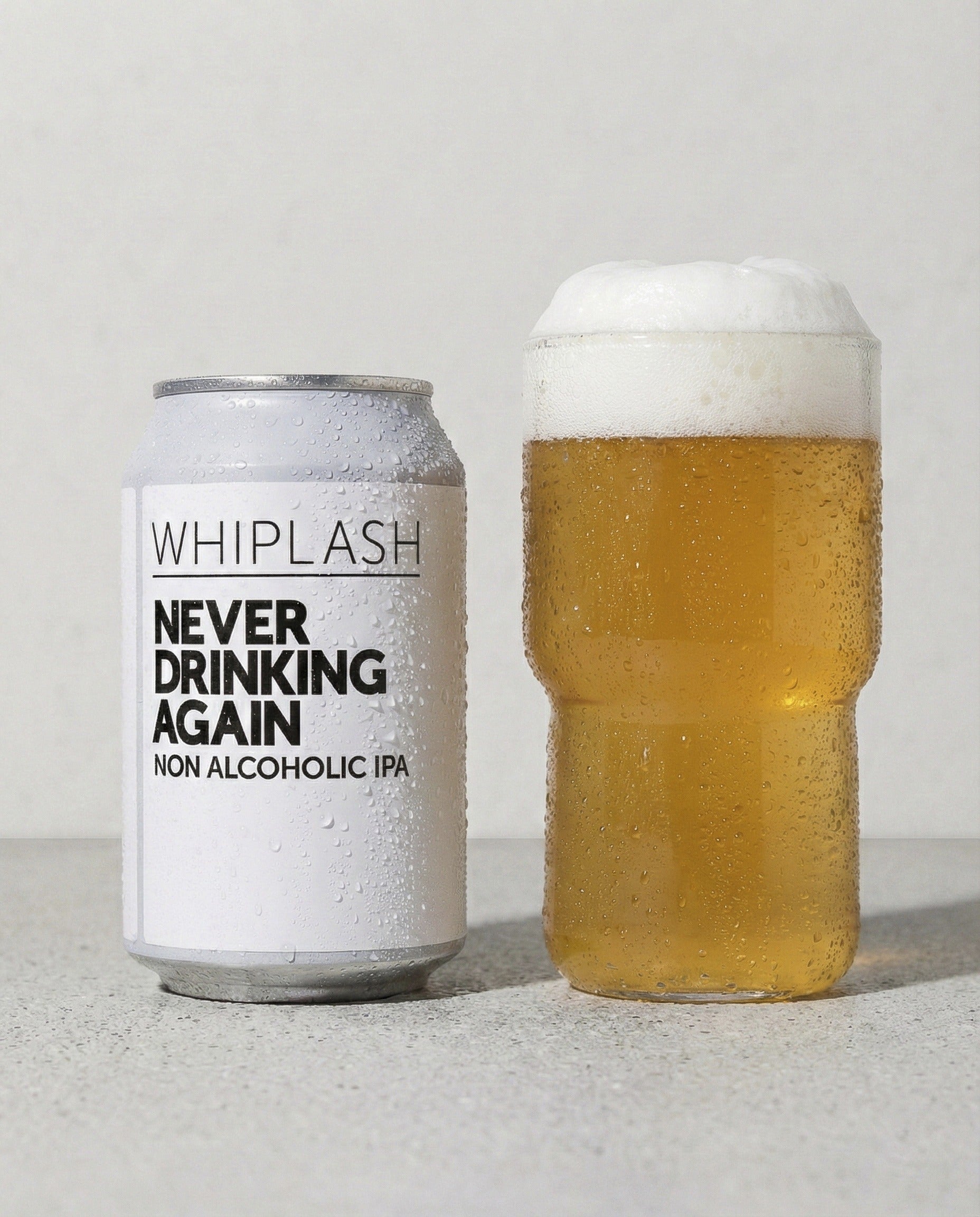 Whiplash Never Drinking Again poured into a glass with foam head